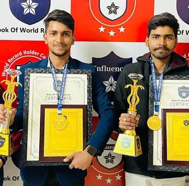 Record holders with their trophies and certificates